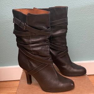 Mid-calf black, leather boots. 3 inch heels. Gorgeous and timeless design.